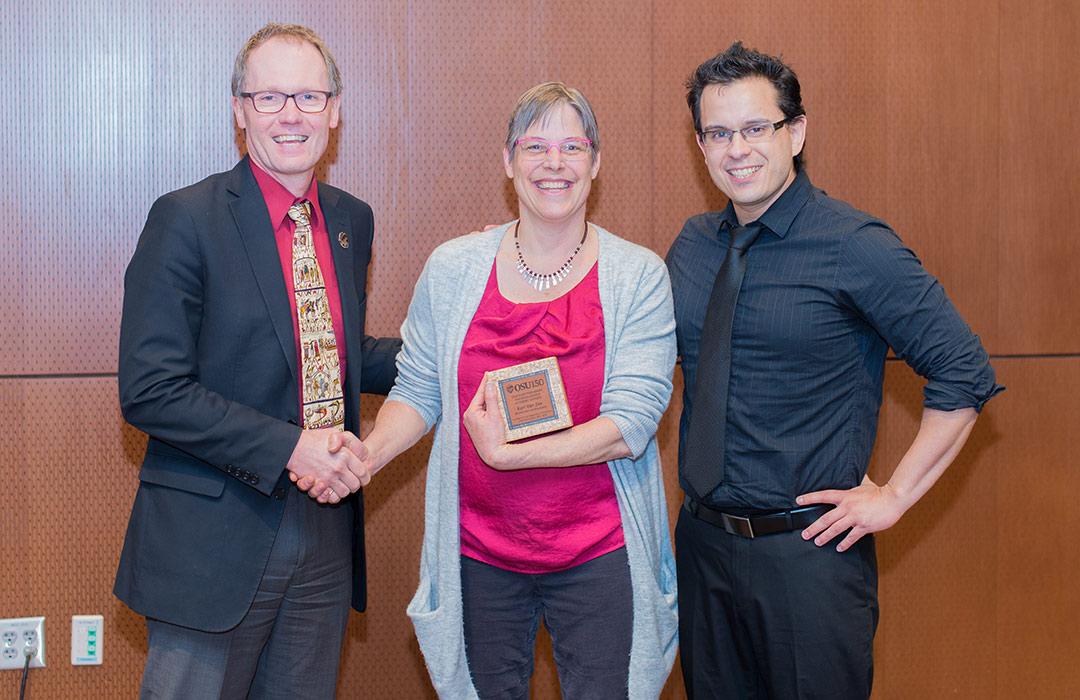 Kari Van Zee receiving award from Roy Haggerty