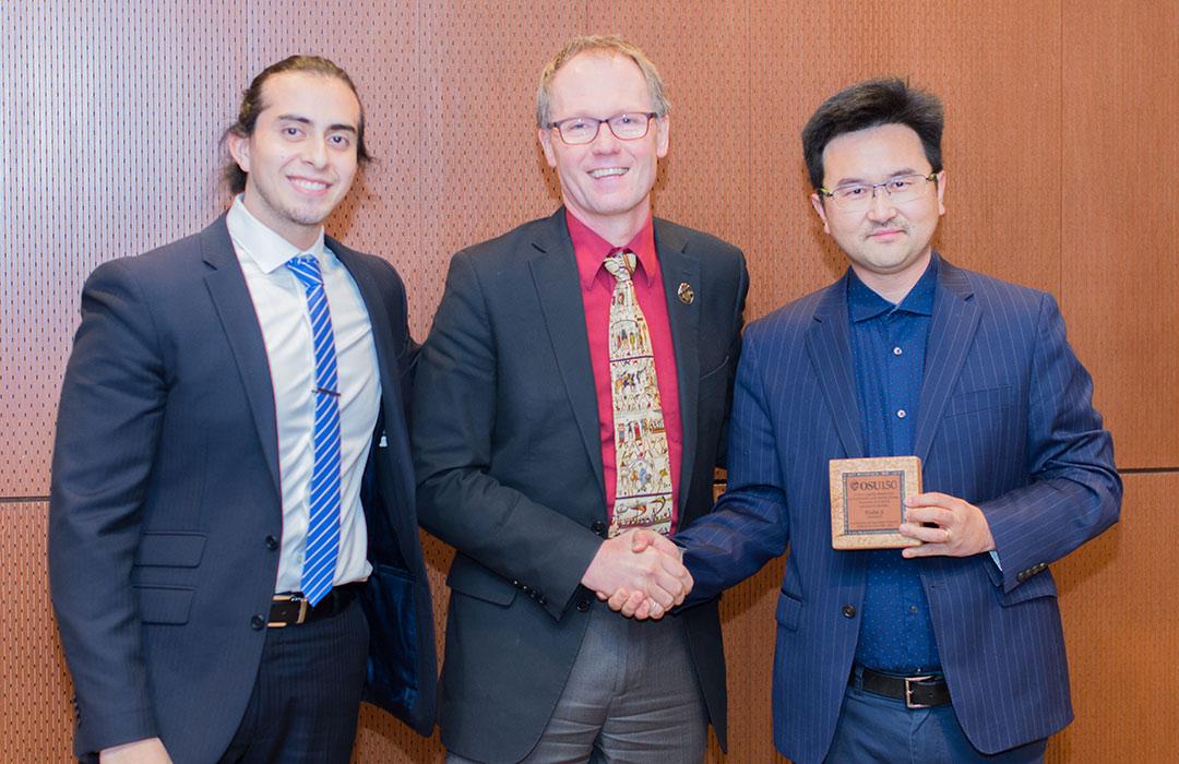 David Ji receiving award from Roy Haggerty