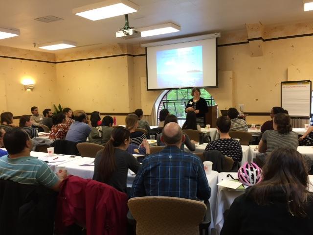 campers sitting in audience listening to mentor lecture