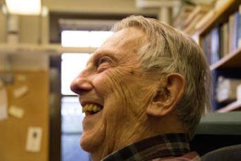 Ken Hedberg smiling in his office space