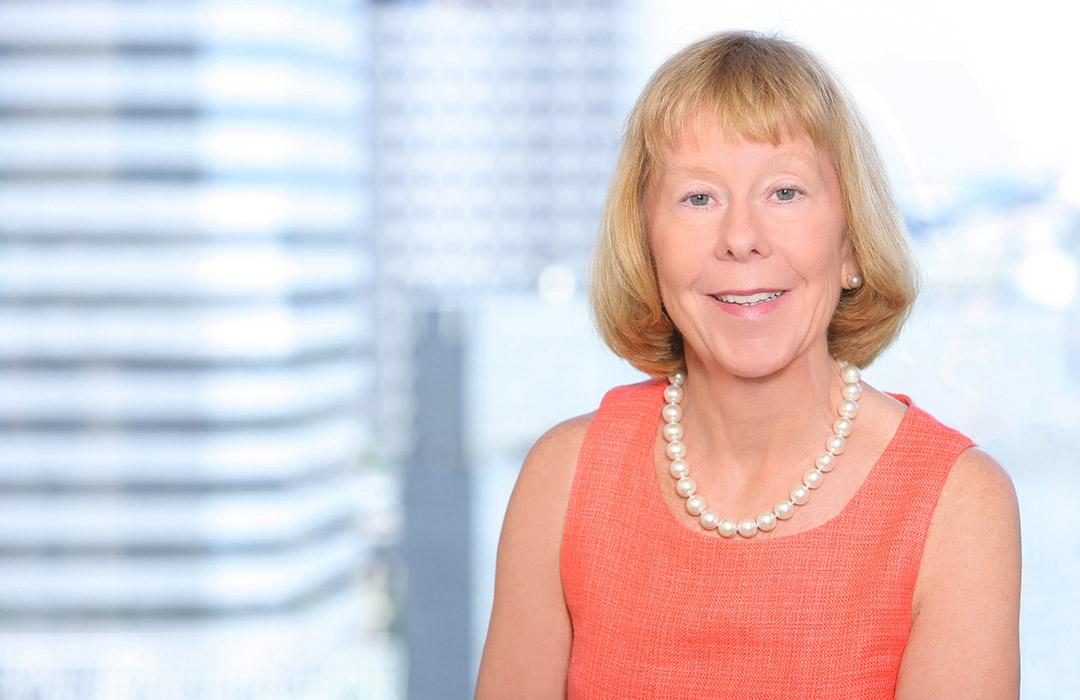 Suzanne McGrath in front of cityscape view