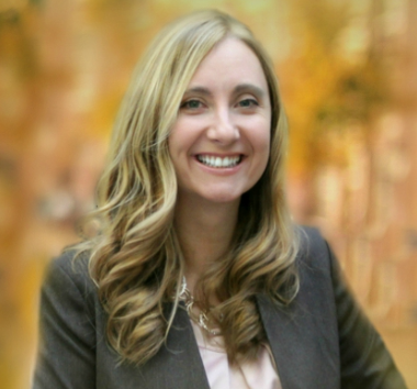 Tamara Mitchell in front of yellow backdrop