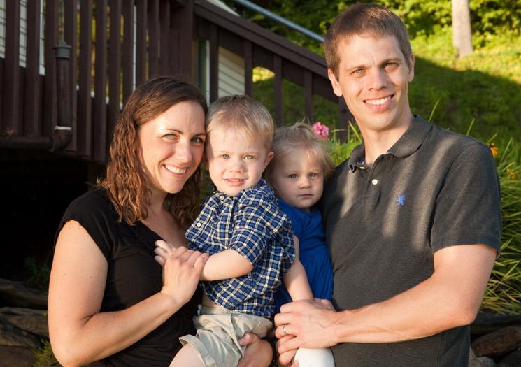 Robert Jacobs and family in front of their house