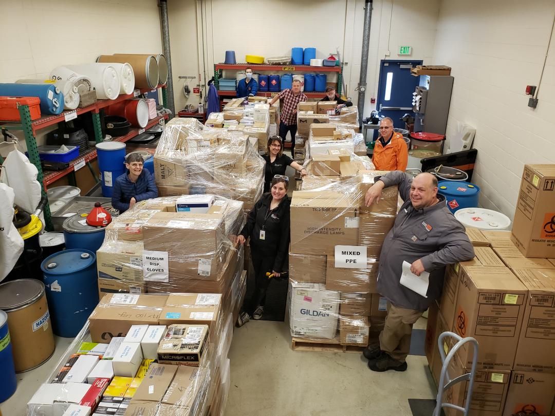 Photo of OSU workers with boxes of collected PPE
