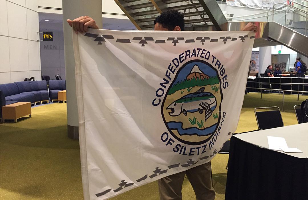 Zoology senior with Tribal flag