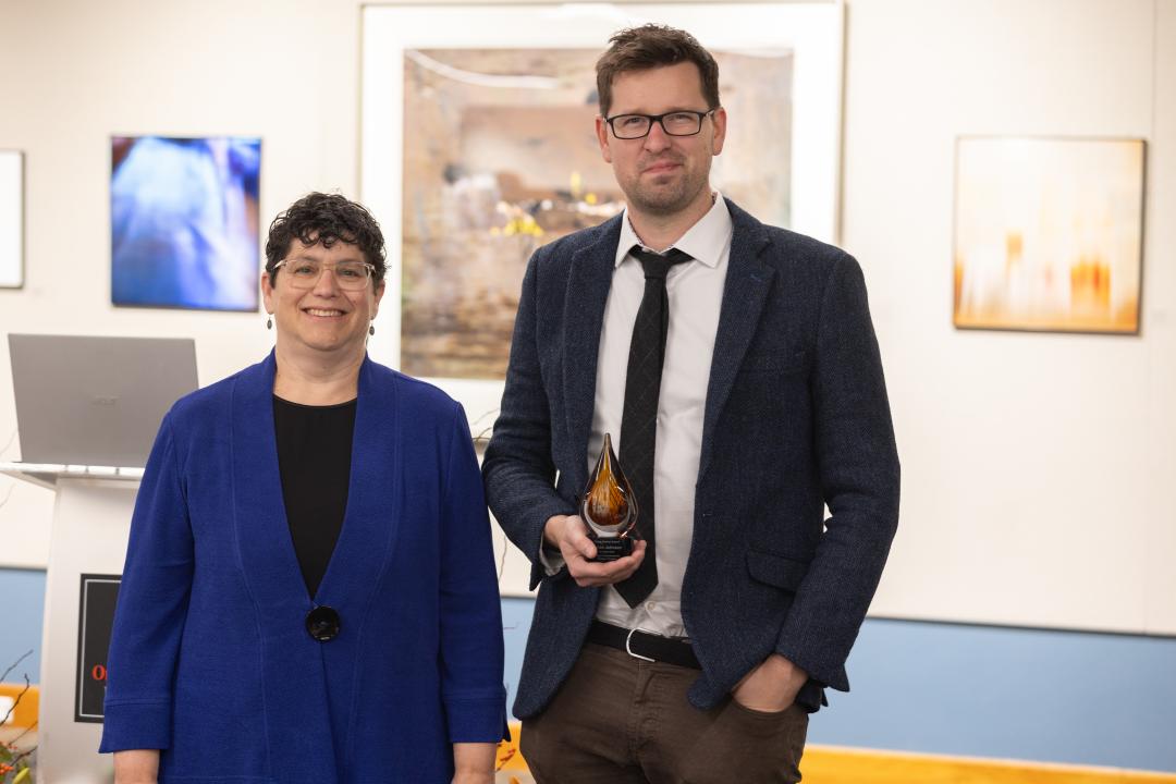 Simon Johnson accepts an award.