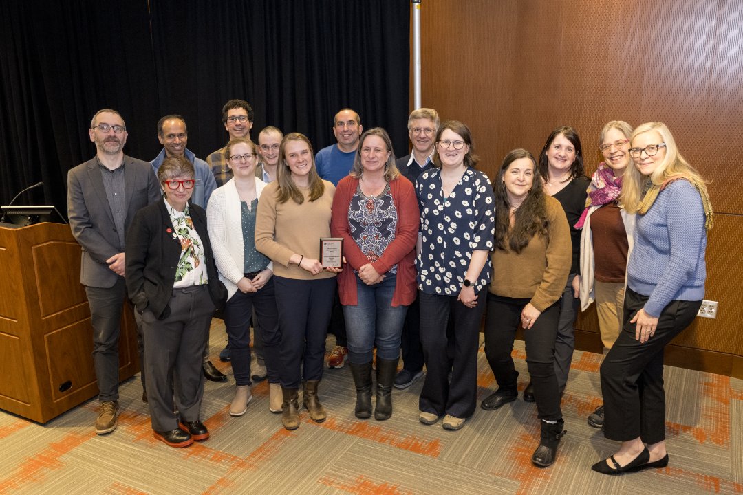 A group of people pose for a photo.