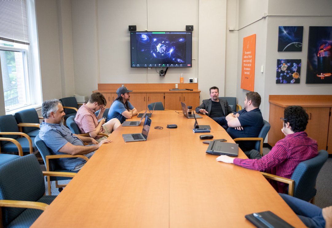 A group of people meeting in a conference room.