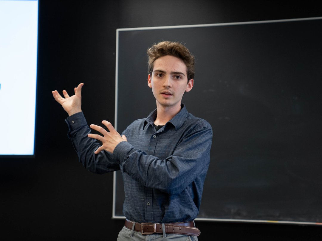 Luikart presents his REU research at the end of the program.