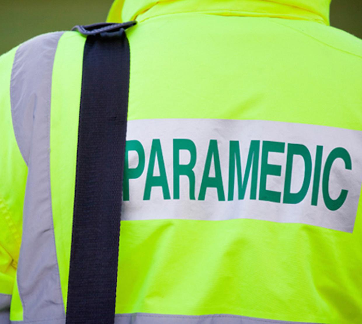 back of neon green paramedic coat
