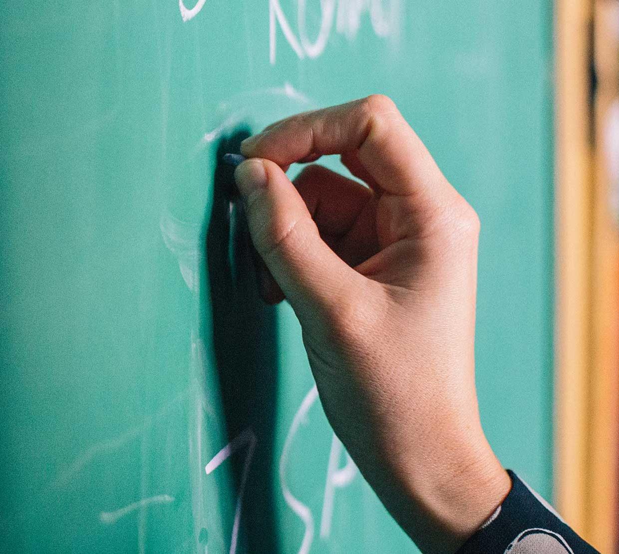 hand writing on chalkboard