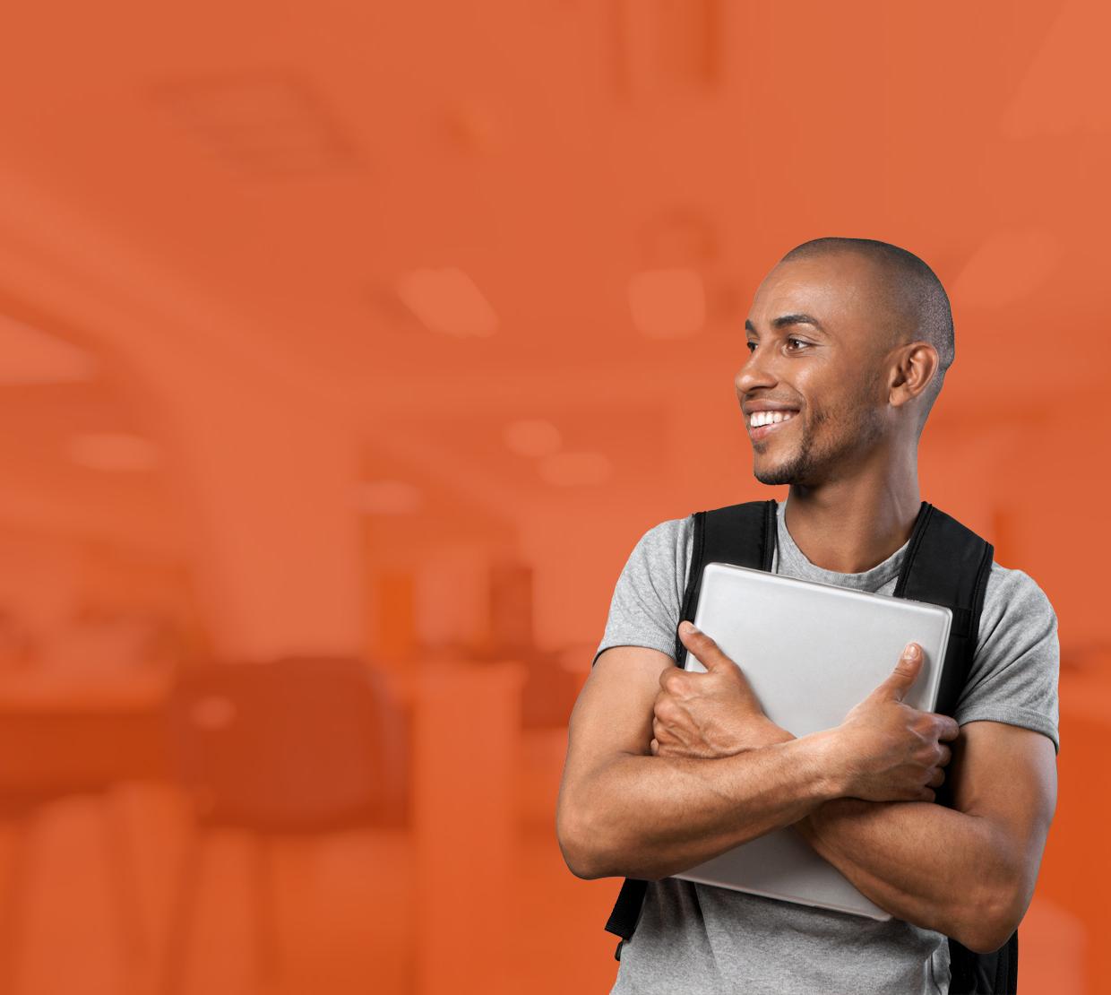 male student in front of orange-filtered classroom