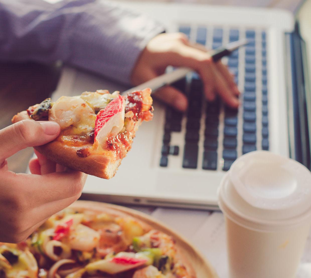 Working on homework with pizza and coffee