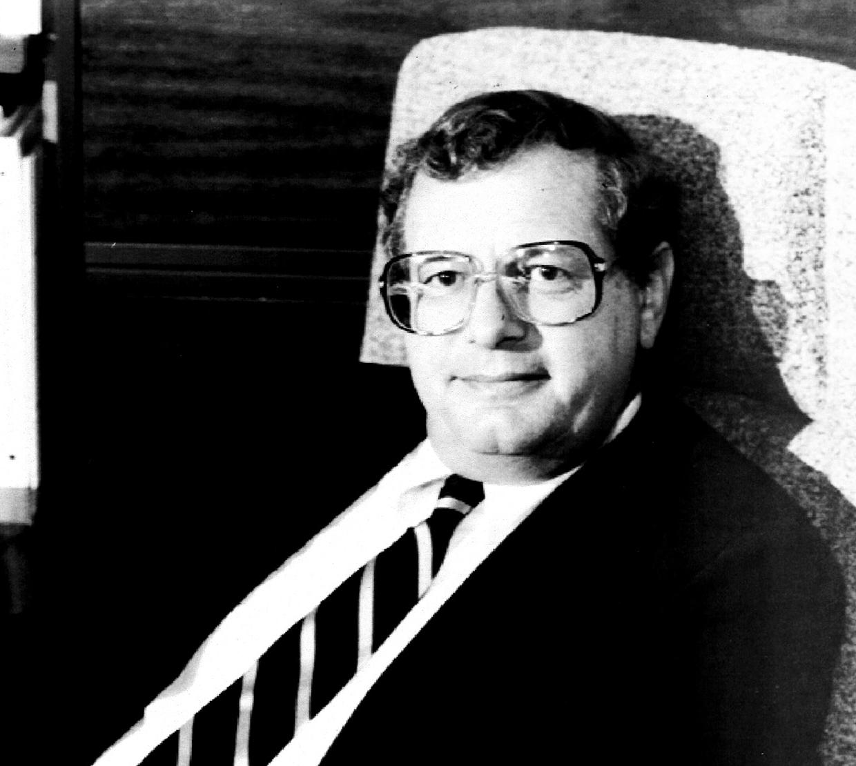 Archival photo of young Fred Horne sitting in lounge