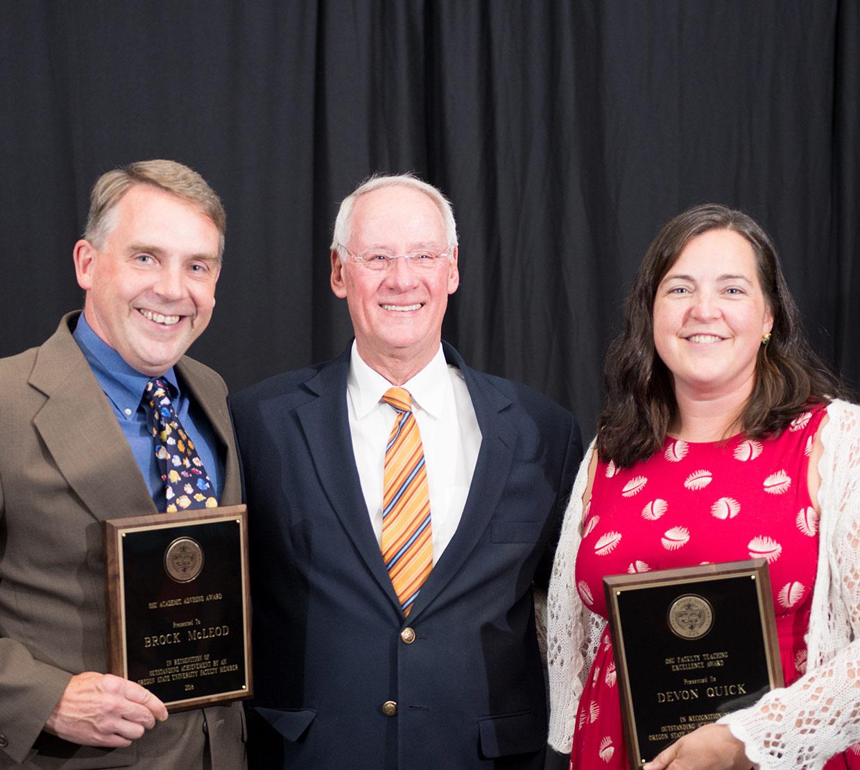 Brock McLeod and Devon Quick recieving awards from Edward John Ray