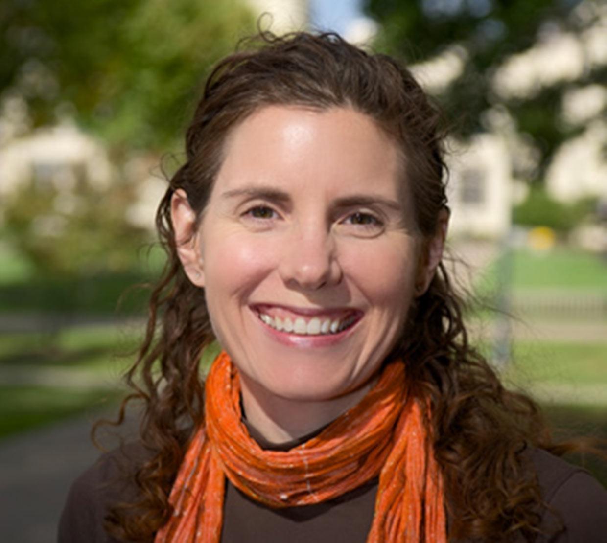 Melissa M. Schultz standing in front of park