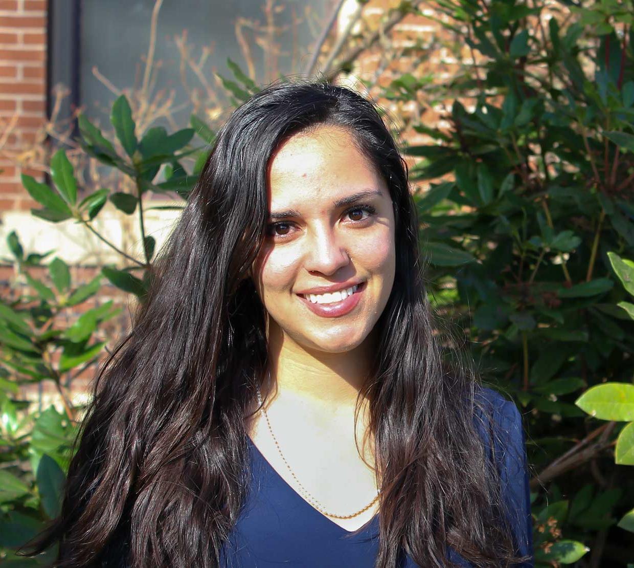 Stephanie Pleasant standing in front of Kidder Hall
