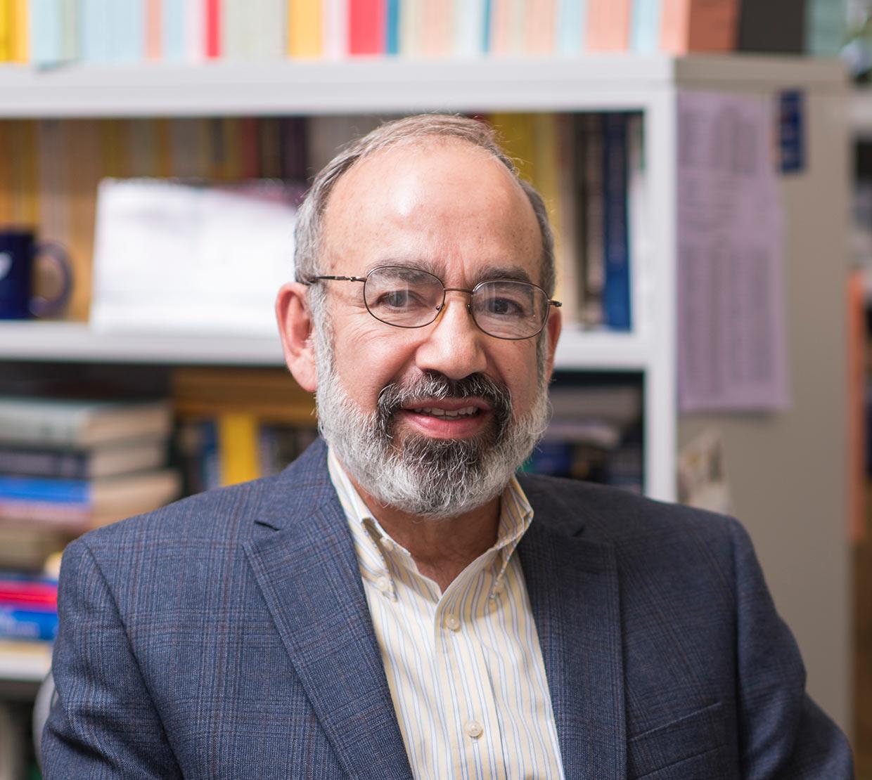 Javier Rojo sitting in office space