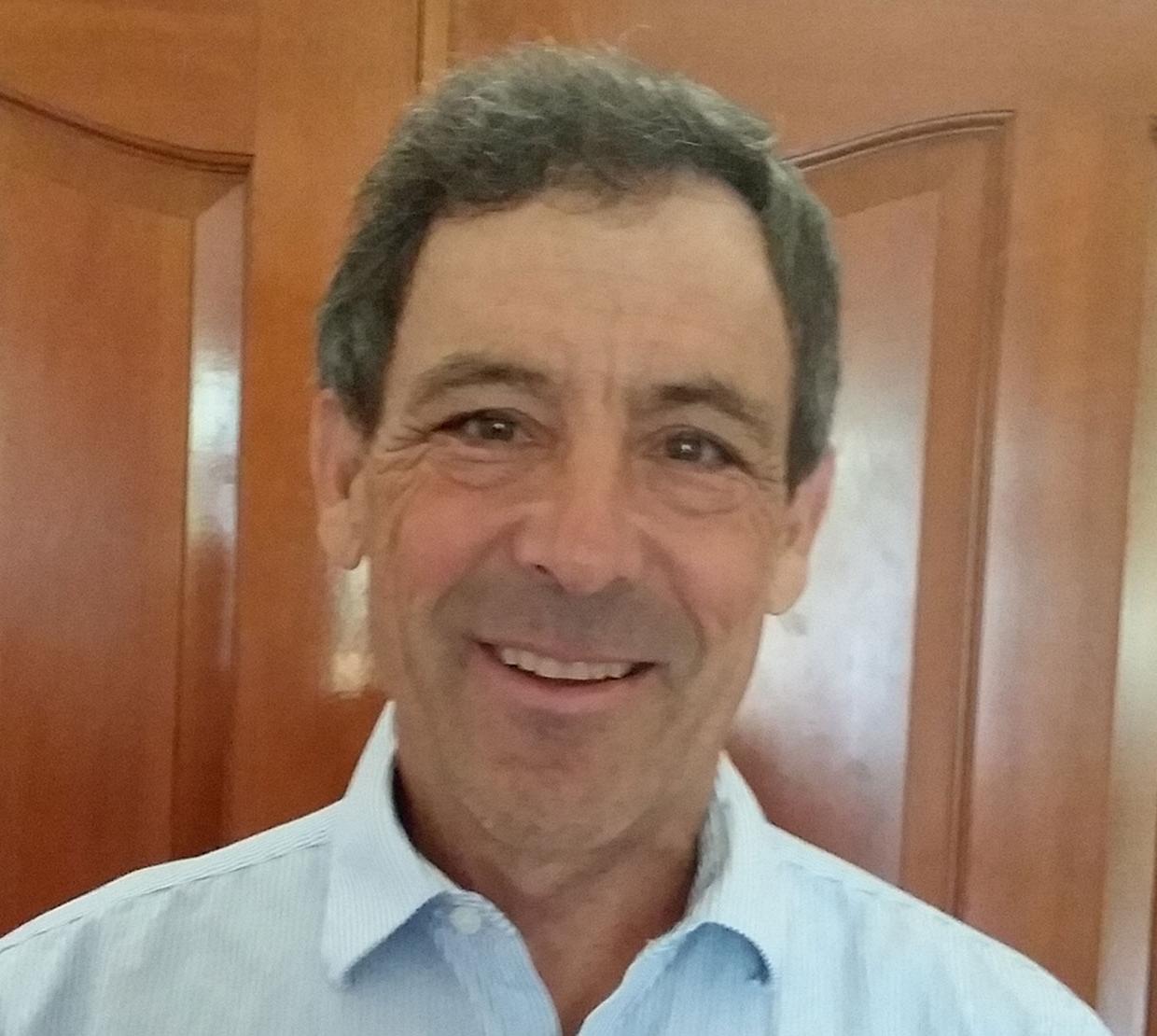 Thomas Cavaiani in front of wooden door