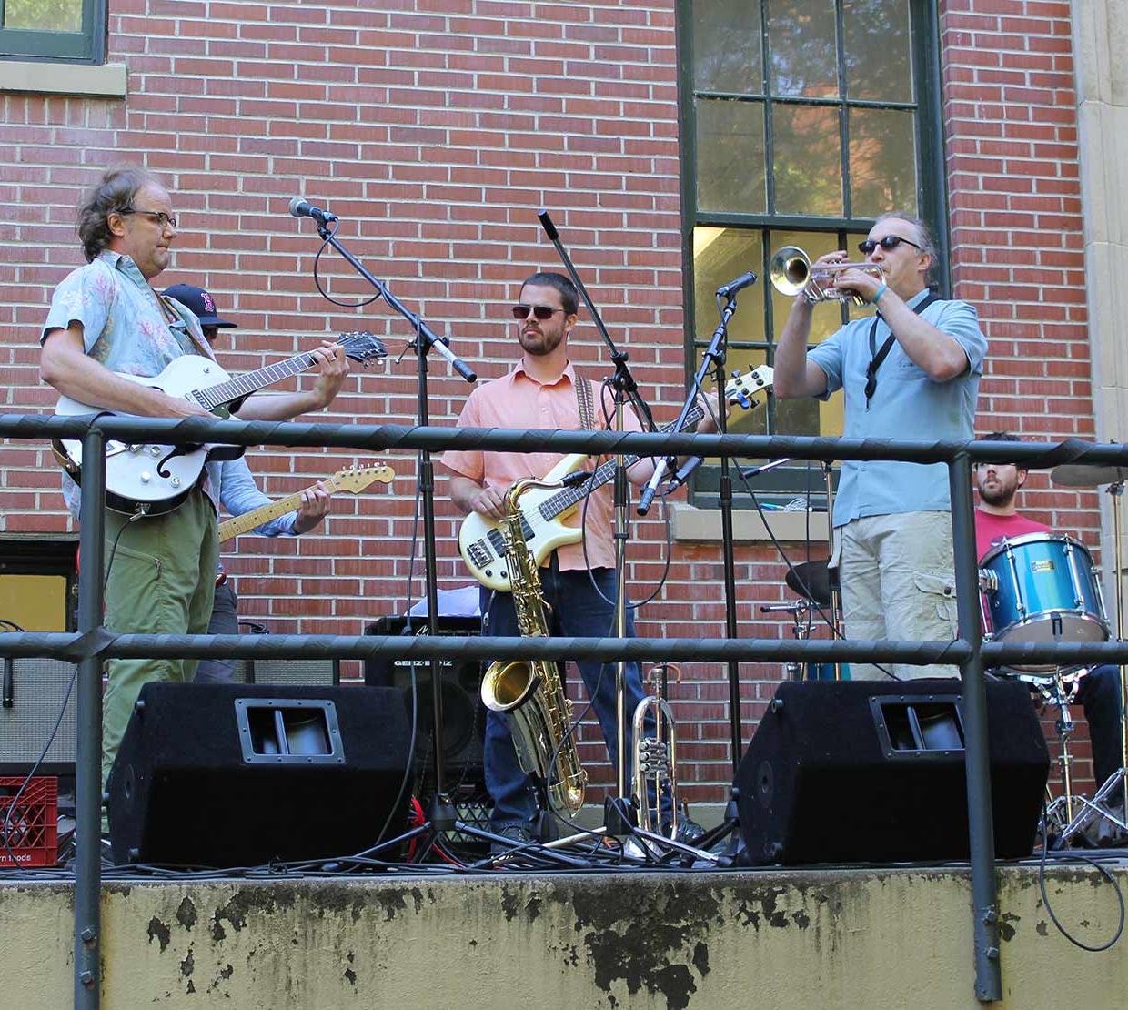 Band playing on outdoor stair set