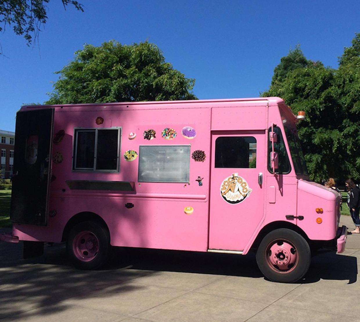 Pink Voodoo truck sitting in front of Milne
