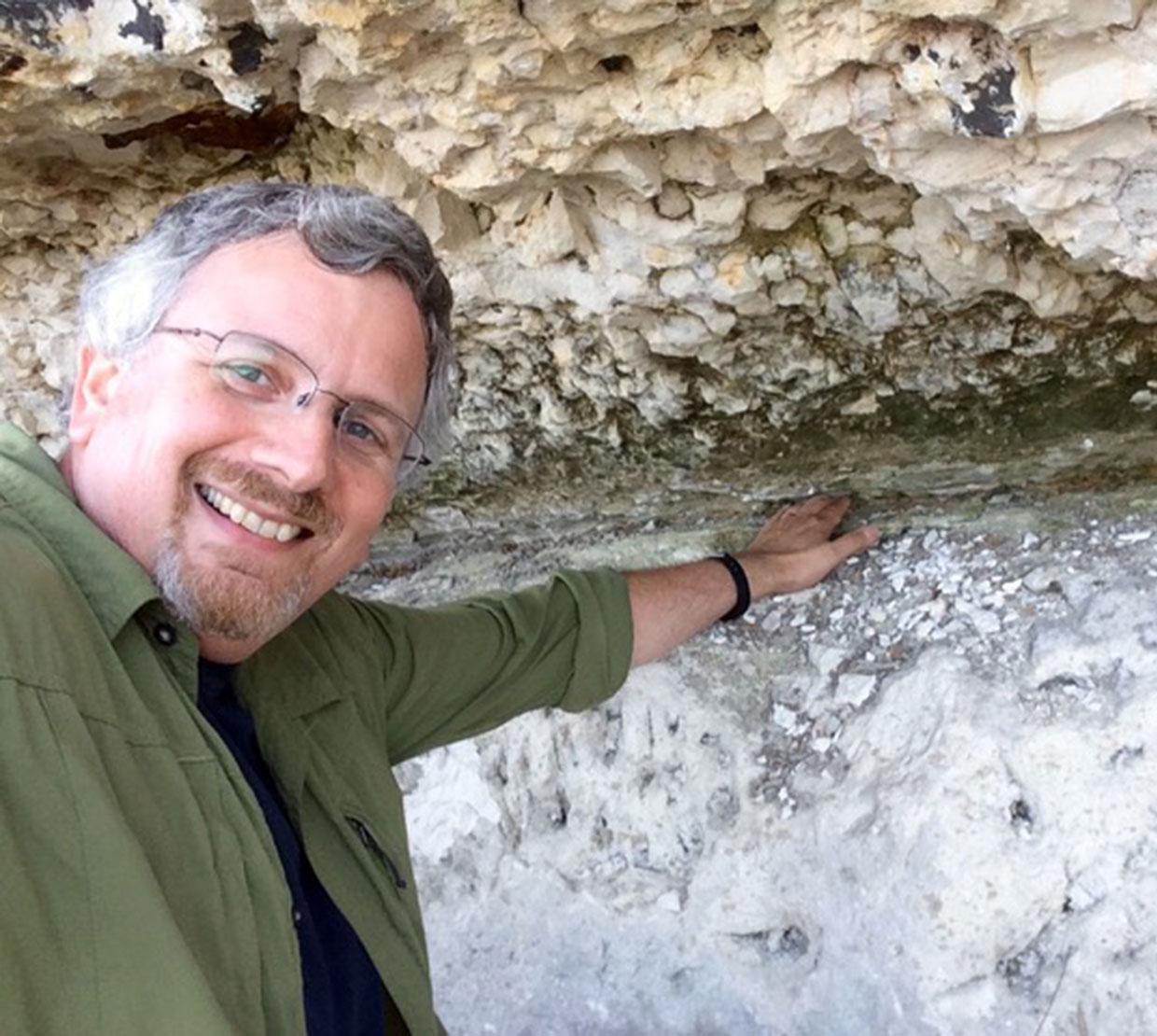 Ariel Anbar checking out rock samples in boulder