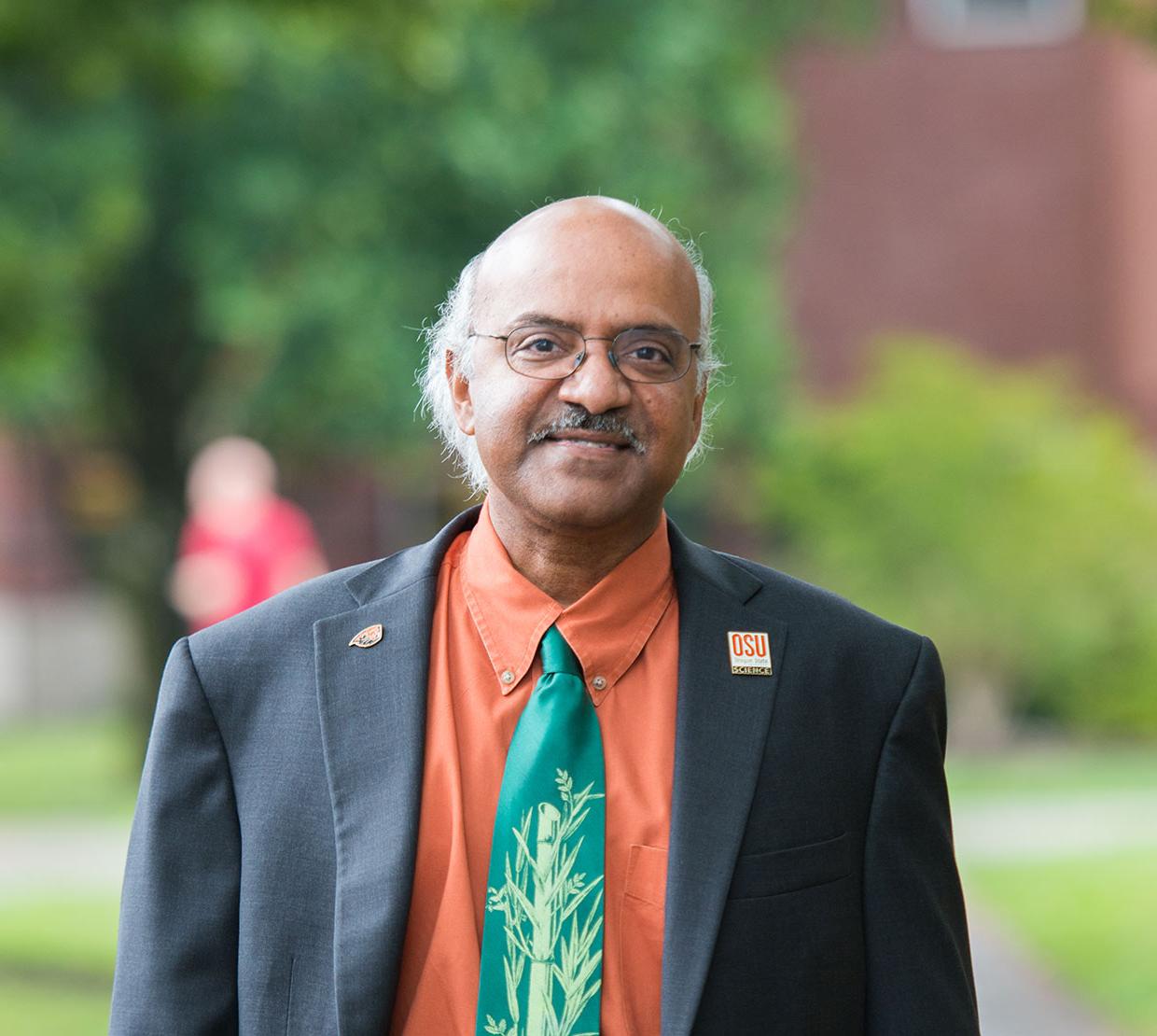 Sastry Pantula standing in front Kidder Hall