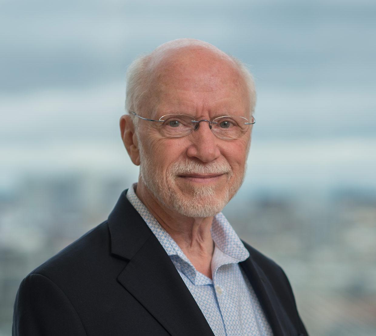 Kent Thornburg standing in front of view of cityscape