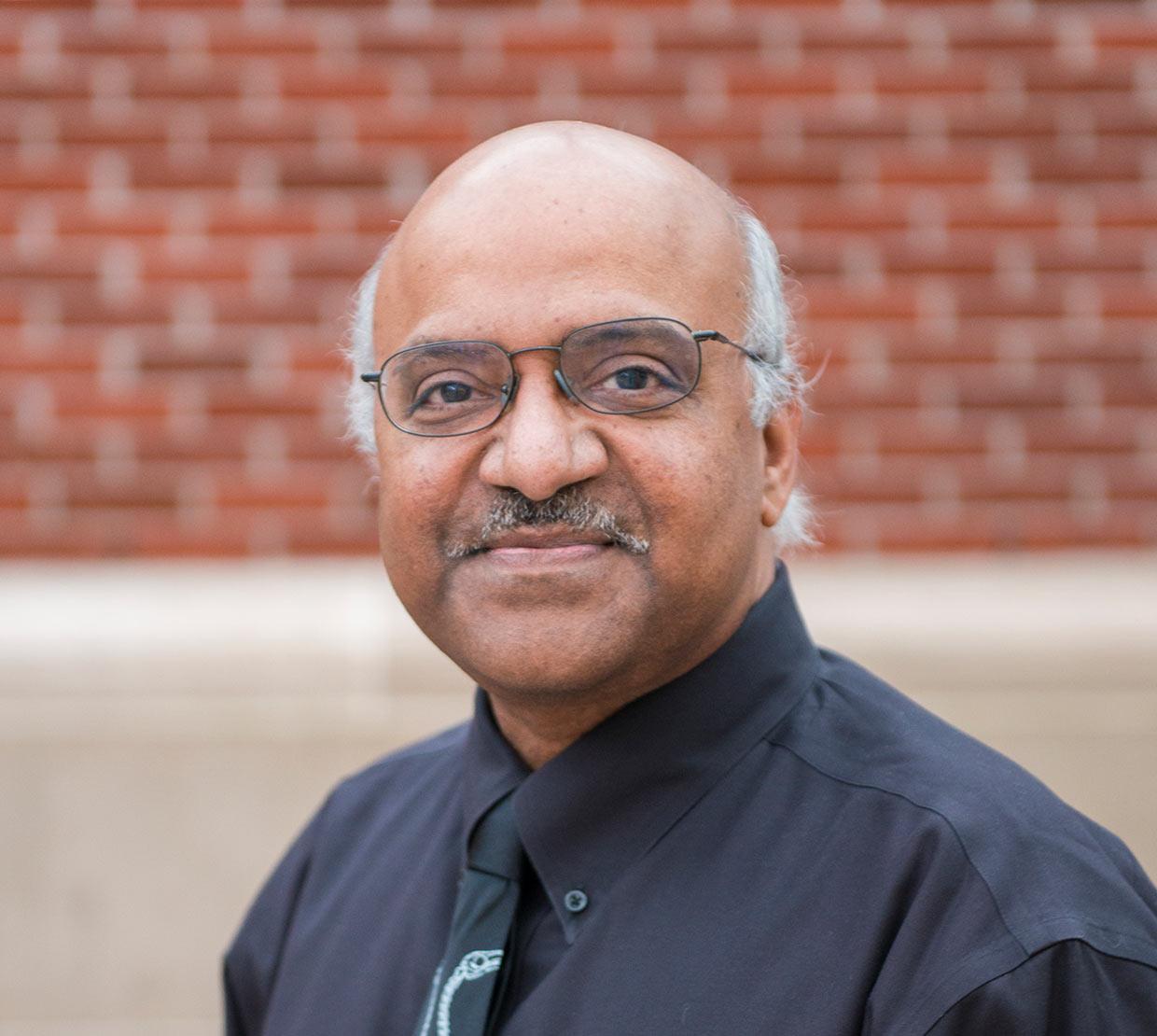 Sastry Pantula standing in SEC awning