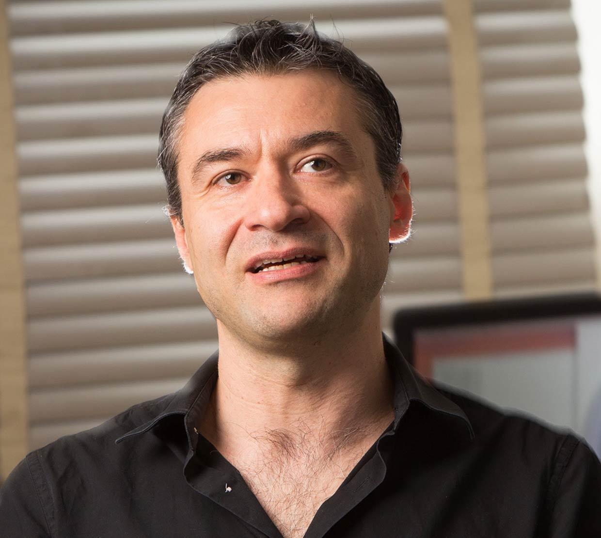 Davide Lazzati standing in office space