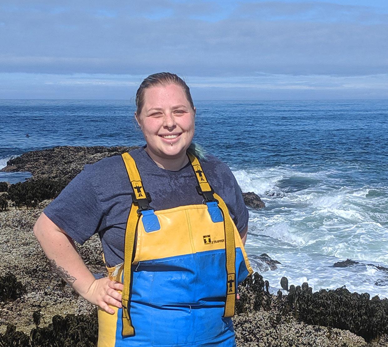 Chantelle MacAdams next to the ocean on a rock