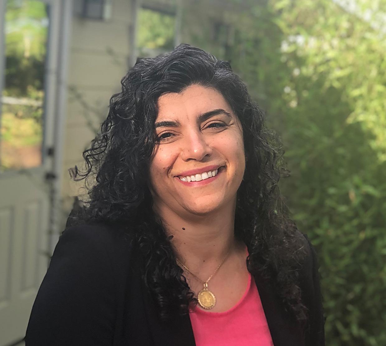 Elisar Barbar in front of house and shrubbery