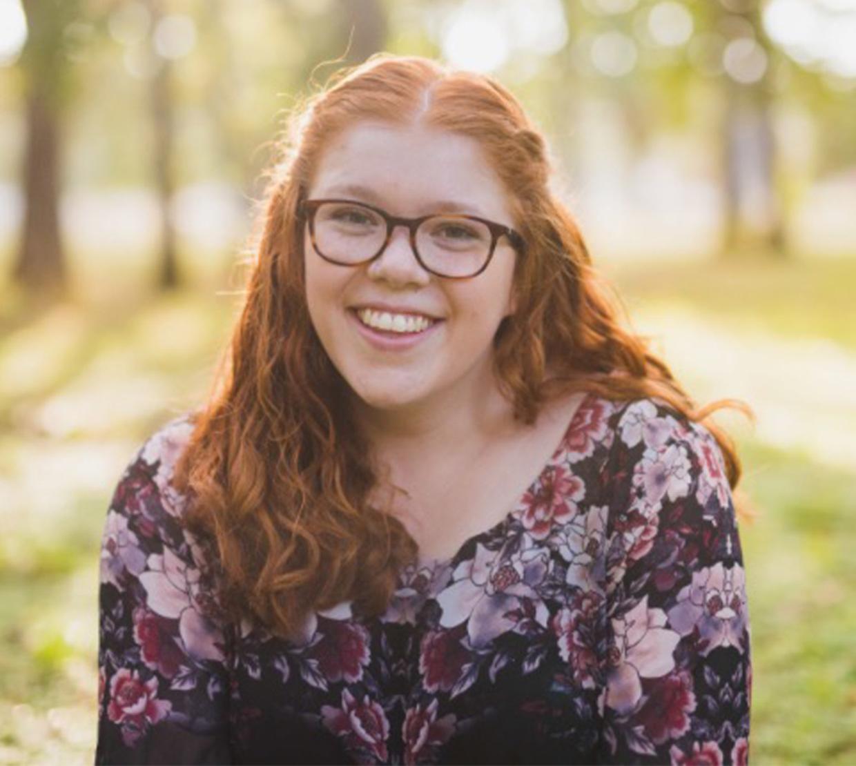 Abigail LaVerdure smiles at camera outside