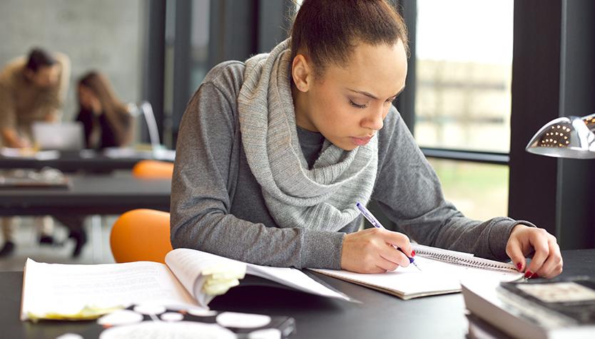 Woman working on homework at table