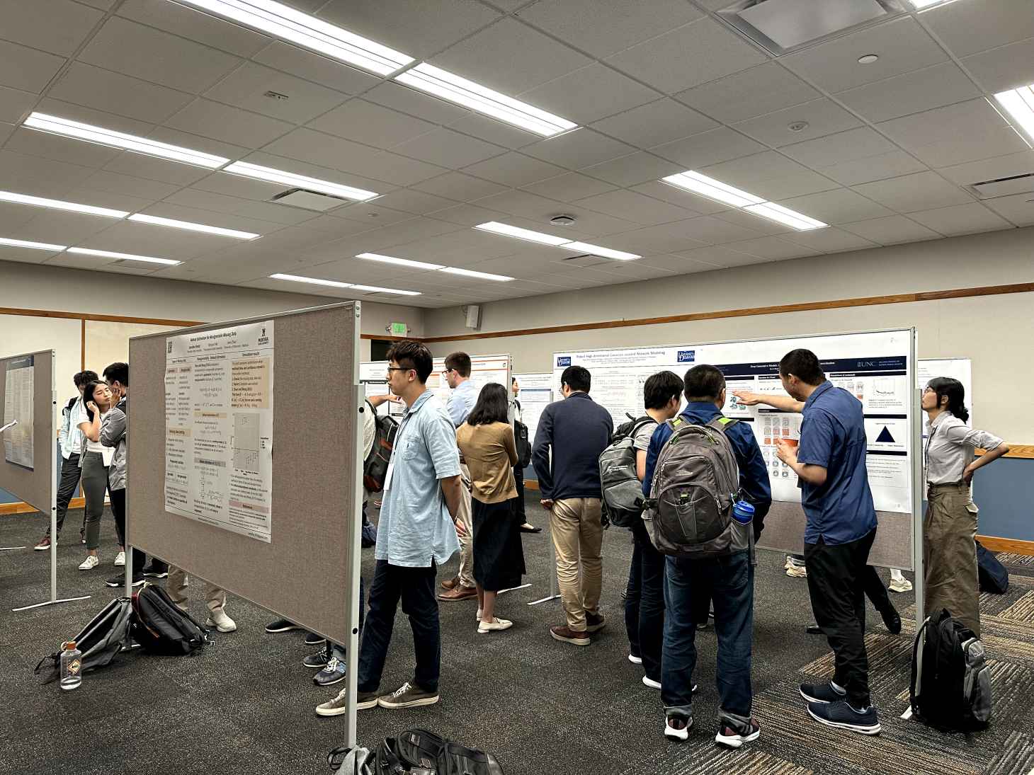 A group of students peruse the posters at the New Researchers Conference in Corvallis, OR.