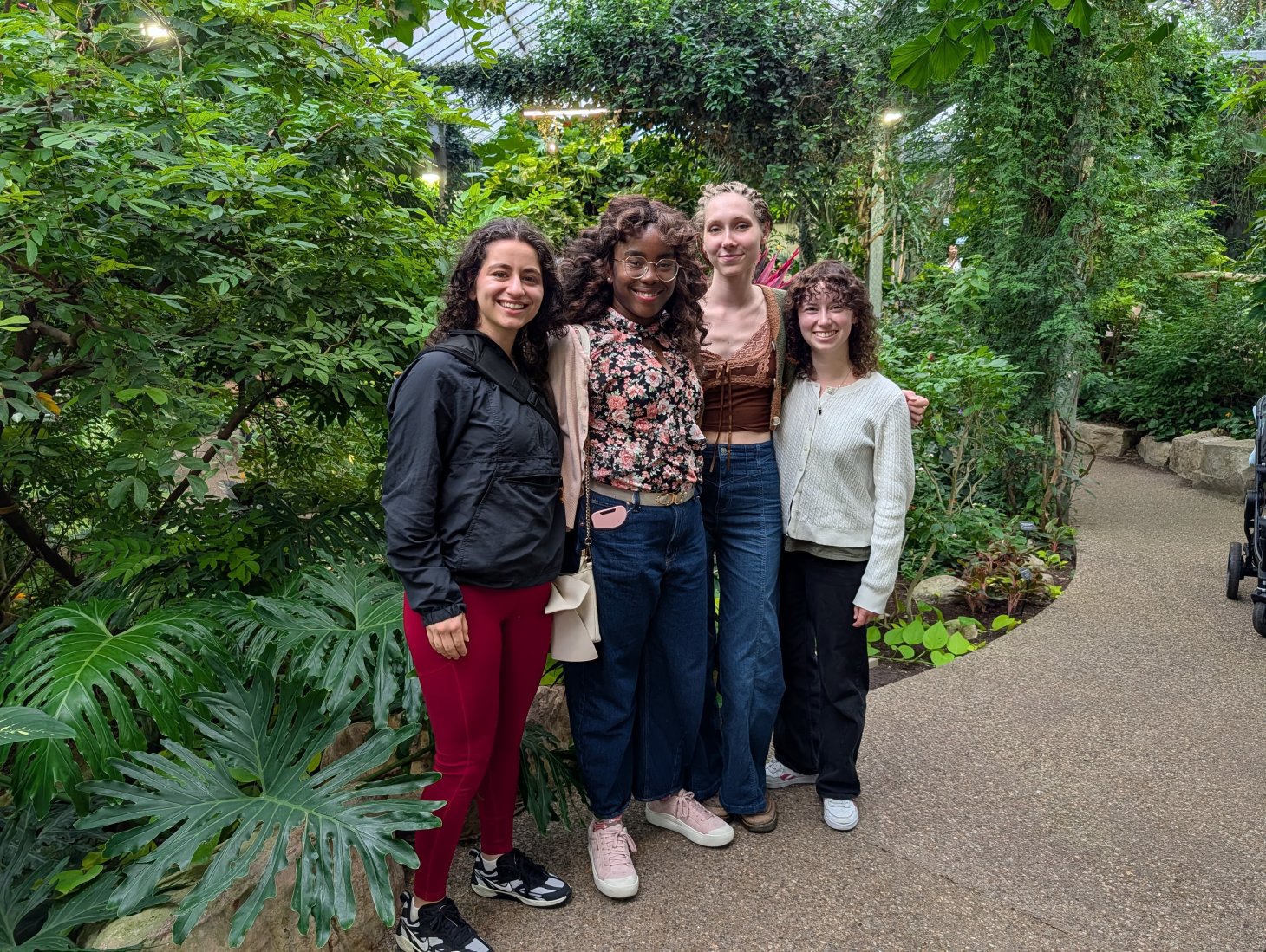 Three woman pose for a photo.