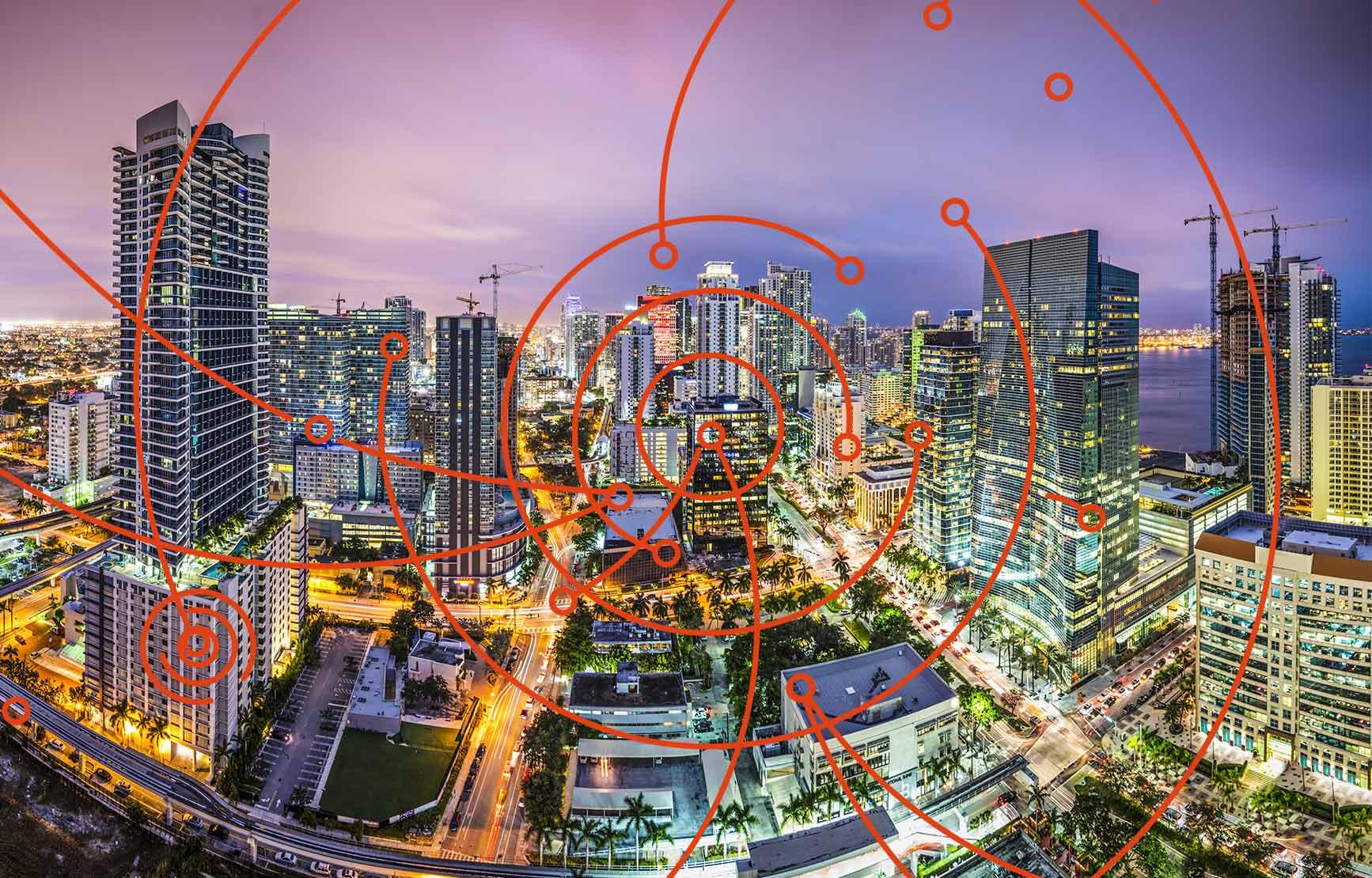 orange spiral icon above arial shot of cityscape