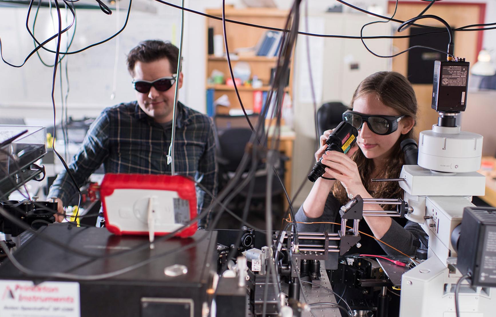 Matt Graham and colleague working in lab.