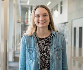 Delaney Smith standing in the Learning and Innovation Center on campus