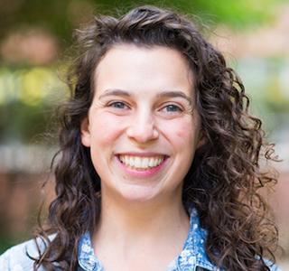 Rebecca Mostow standing in garden