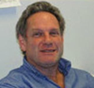 Rich Carone sitting in office space