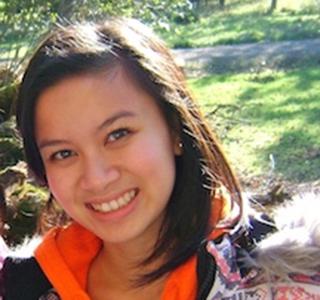 Van Ahn Vu standing outside field