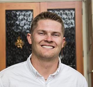 Morgan Pearson in front of Kidder Hall