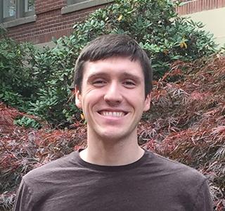 Nathan Coddington standing outside Kidder Hall