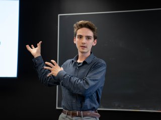Luikart presents his REU research at the end of the program.