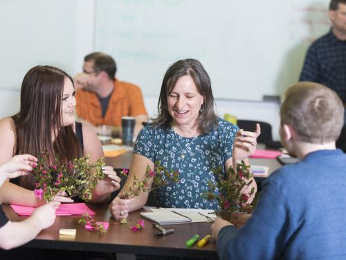 Lori Kayes working with students in a classroom.