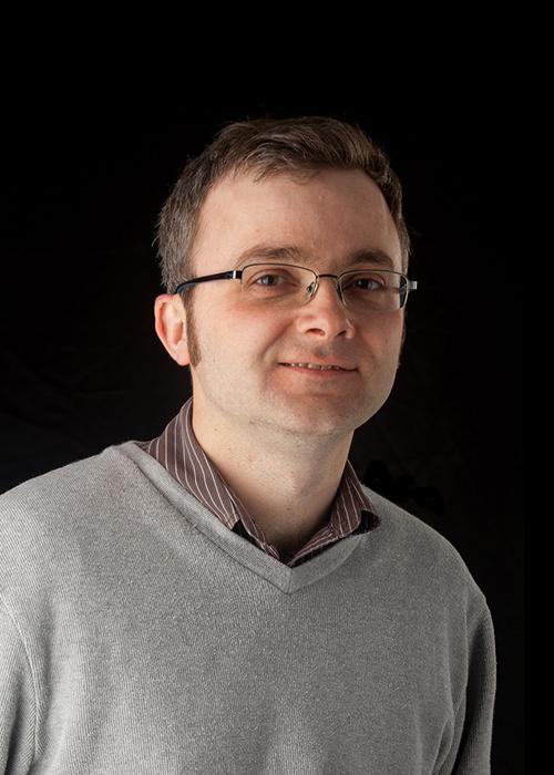 Paul Blakemore in front of black backdrop