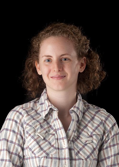 Paula Weiss in front of black backdrop