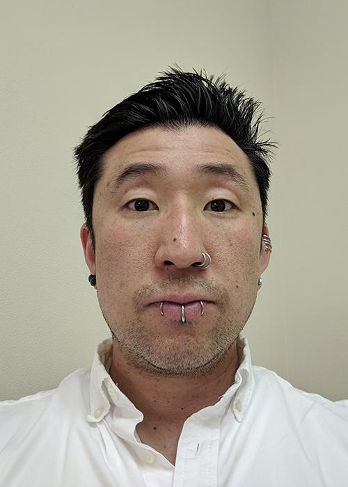 Tat Hatase in front of white backdrop