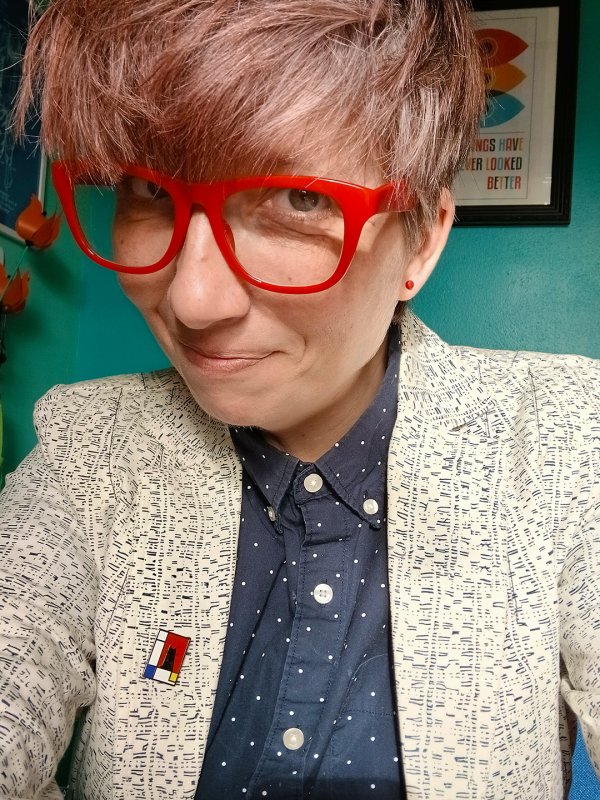 Gabs James smiling in an office selfie